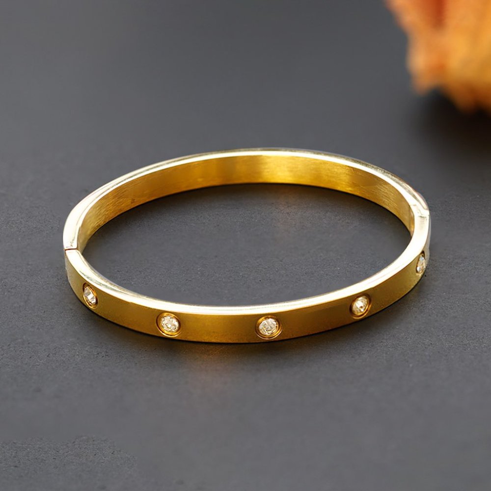 bracelet similar to love bracelet. gold plated